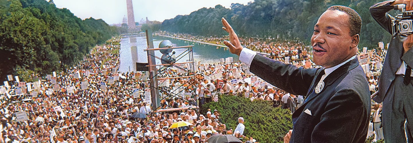 Martin Luther King Jr. speaks in front of a large crowd at the Washington Monument