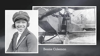 Bessie Coleman smiles. Bessy stands on the wing of her plane.