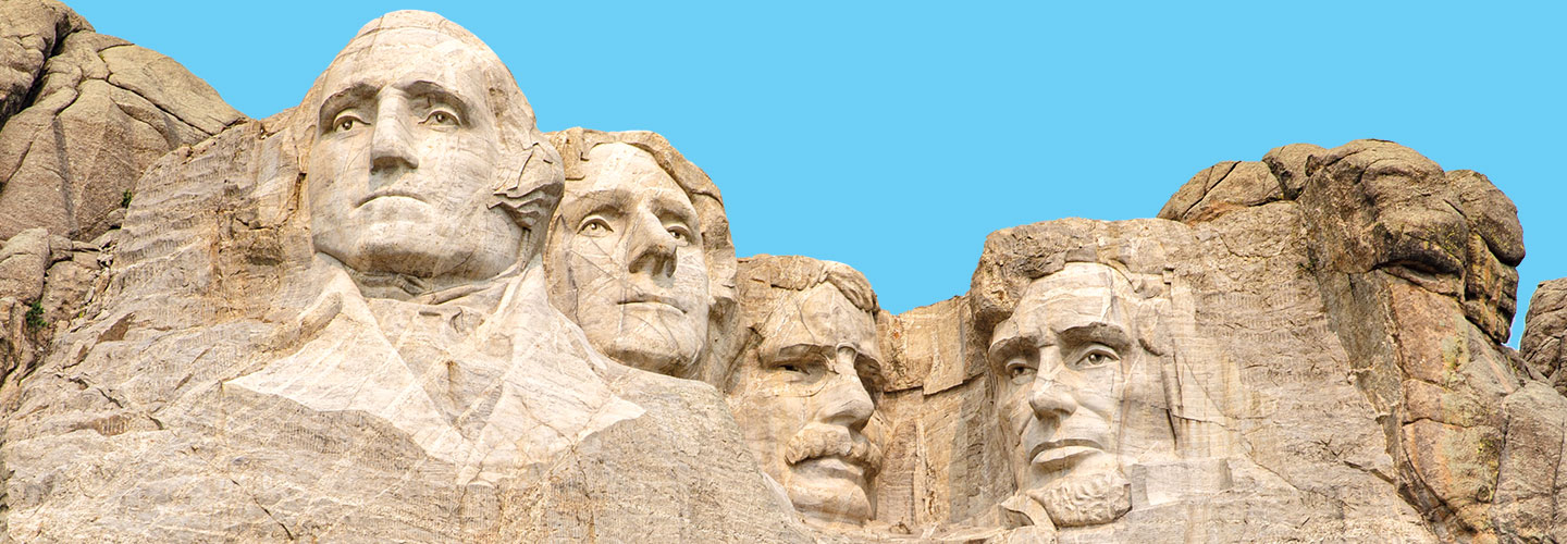 Mount Rushmore is carved with the faces of President Washington, Jefferson, Roosevelt, and Lincoln