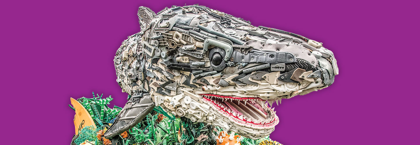 A shark sculpture made from bits of trash