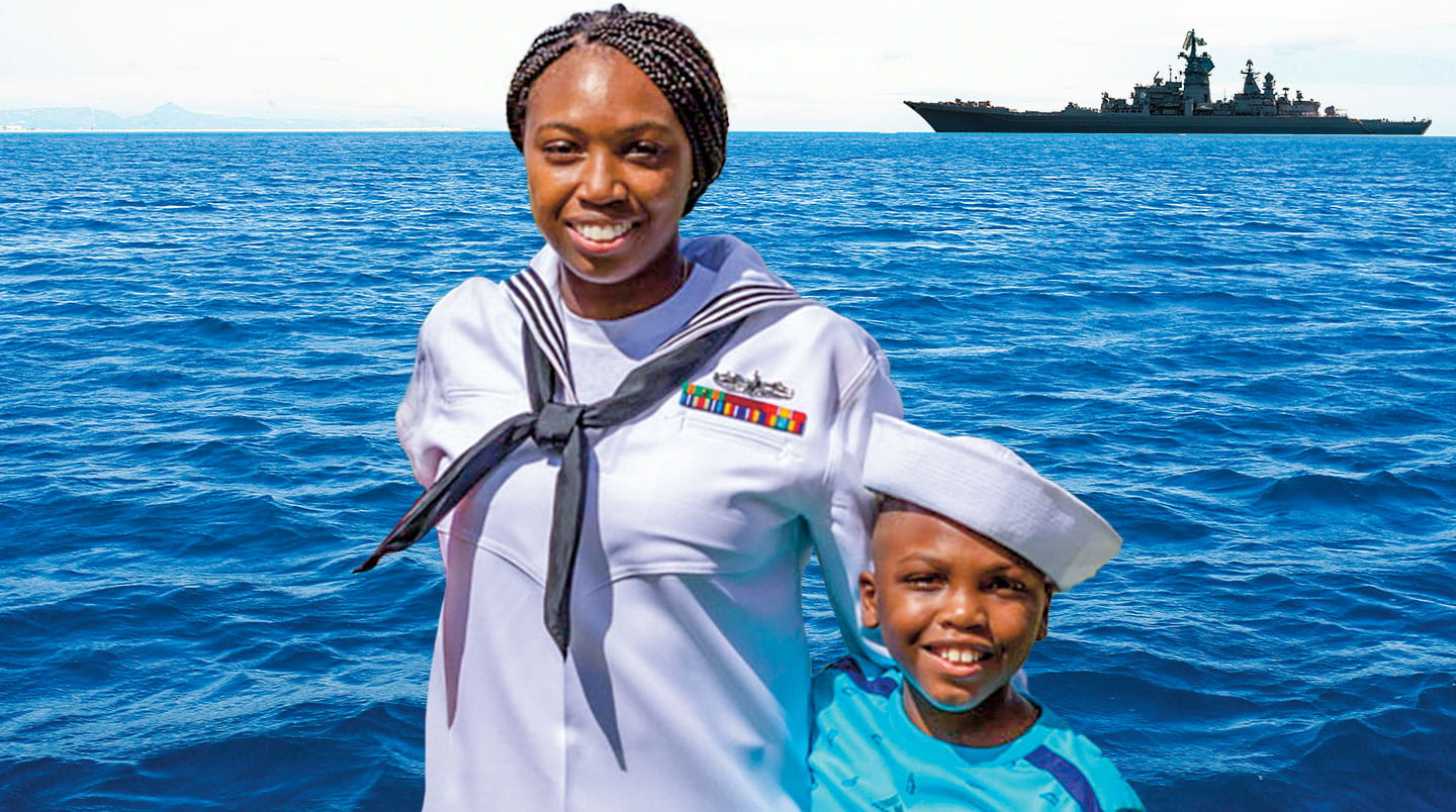 A woman in the navy smiles with her son.