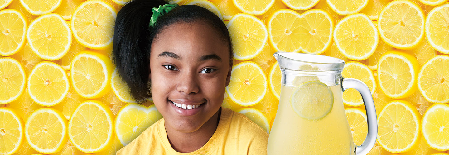 Hayli Martenez smiles with a pitcher of lemonade.