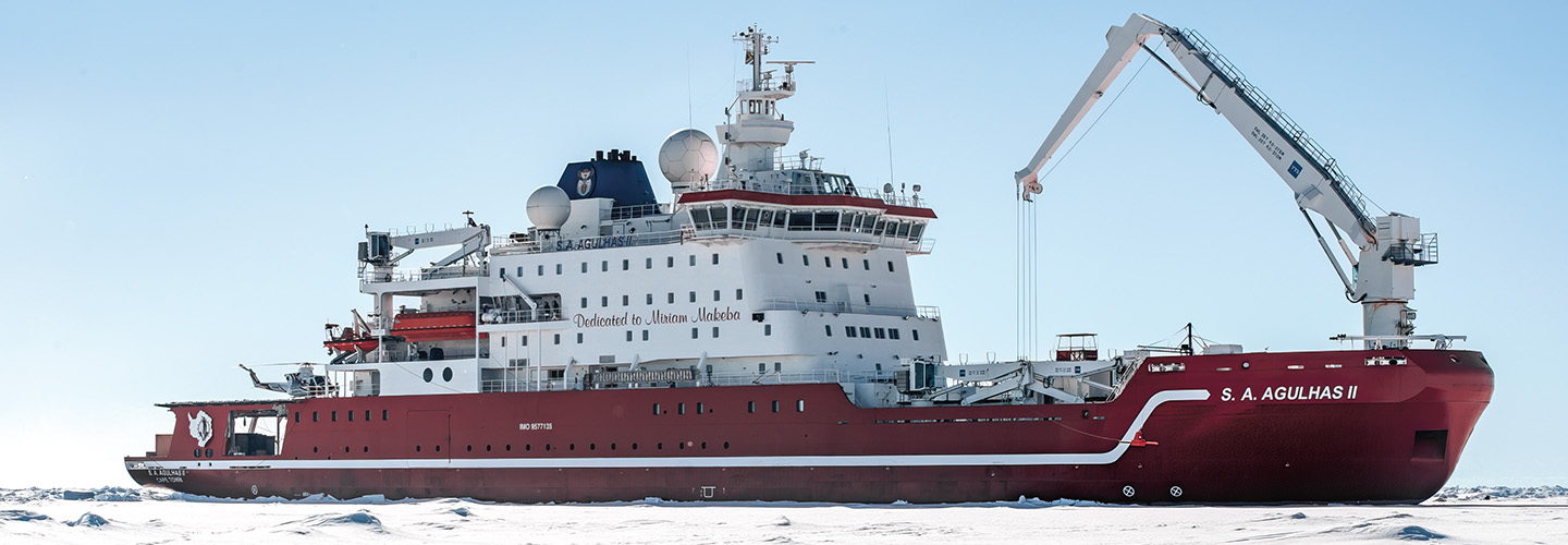 Image of a large ship pushing through ice