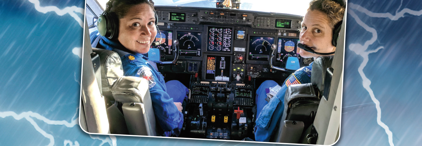 Photo of two pilots driving a plane against a backdrop of lightning