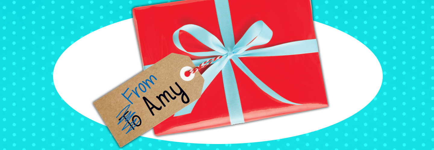 Image of a gift with the "To" crossed out and "From Amy" written instead