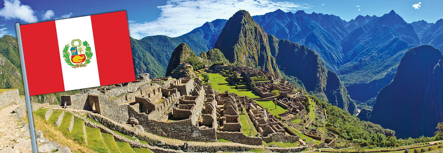 Bird&apos;s eye view of Machu Picchu and flag of Peru