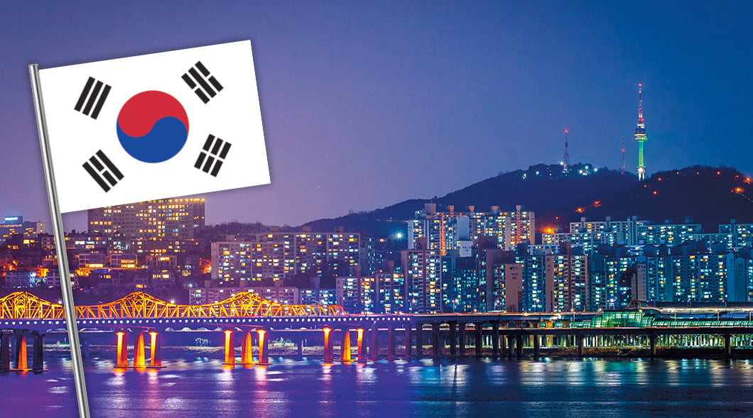 Photo of Seoul at night and the South Korean flag
