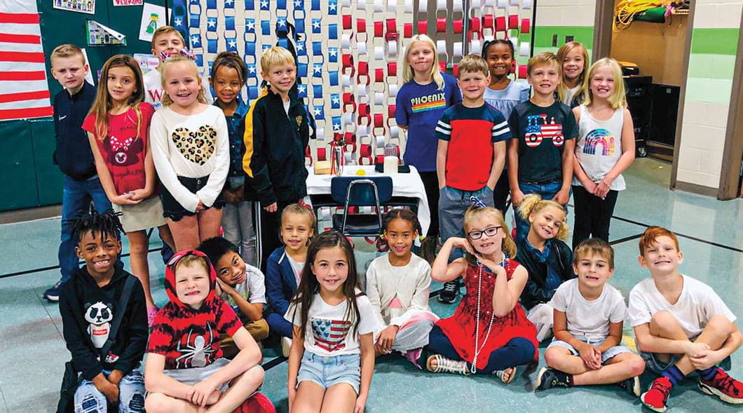 Photo of a class of students wearing red, white, and blue