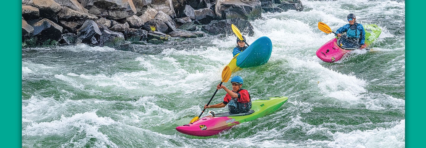 Photo of people kayaking a treacherous river